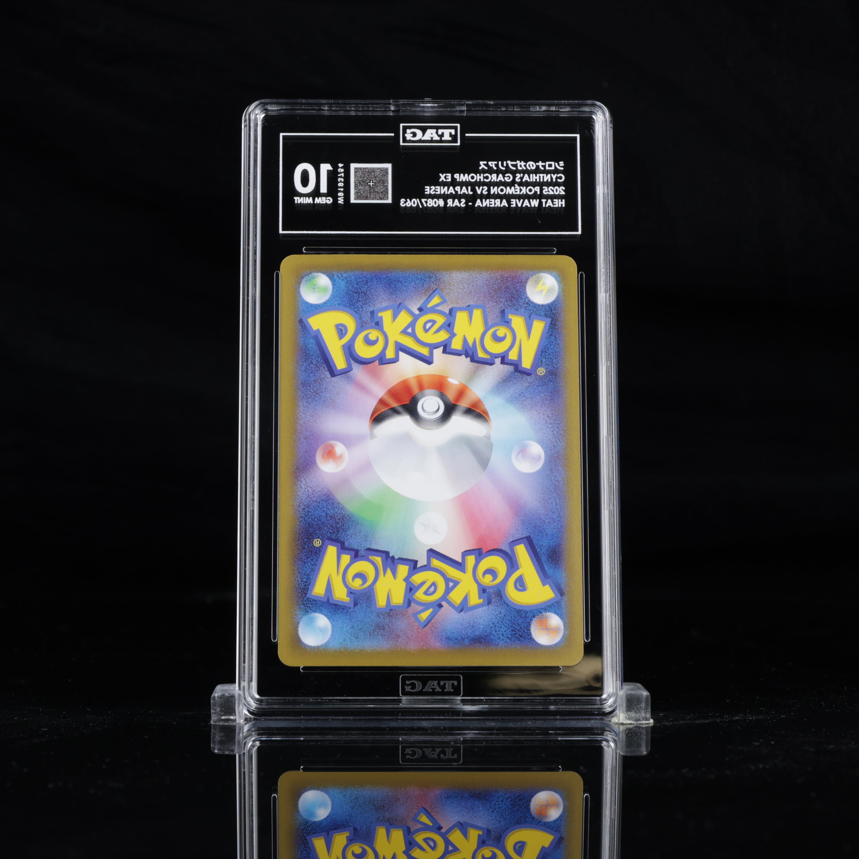 Back view of TAG slab containing Cynthia’s Garchomp EX SAR 087/063 Japanese Pokémon card, showing the official Pokémon card back design and TAG grading label with GEM MINT 10 grade. 1x1