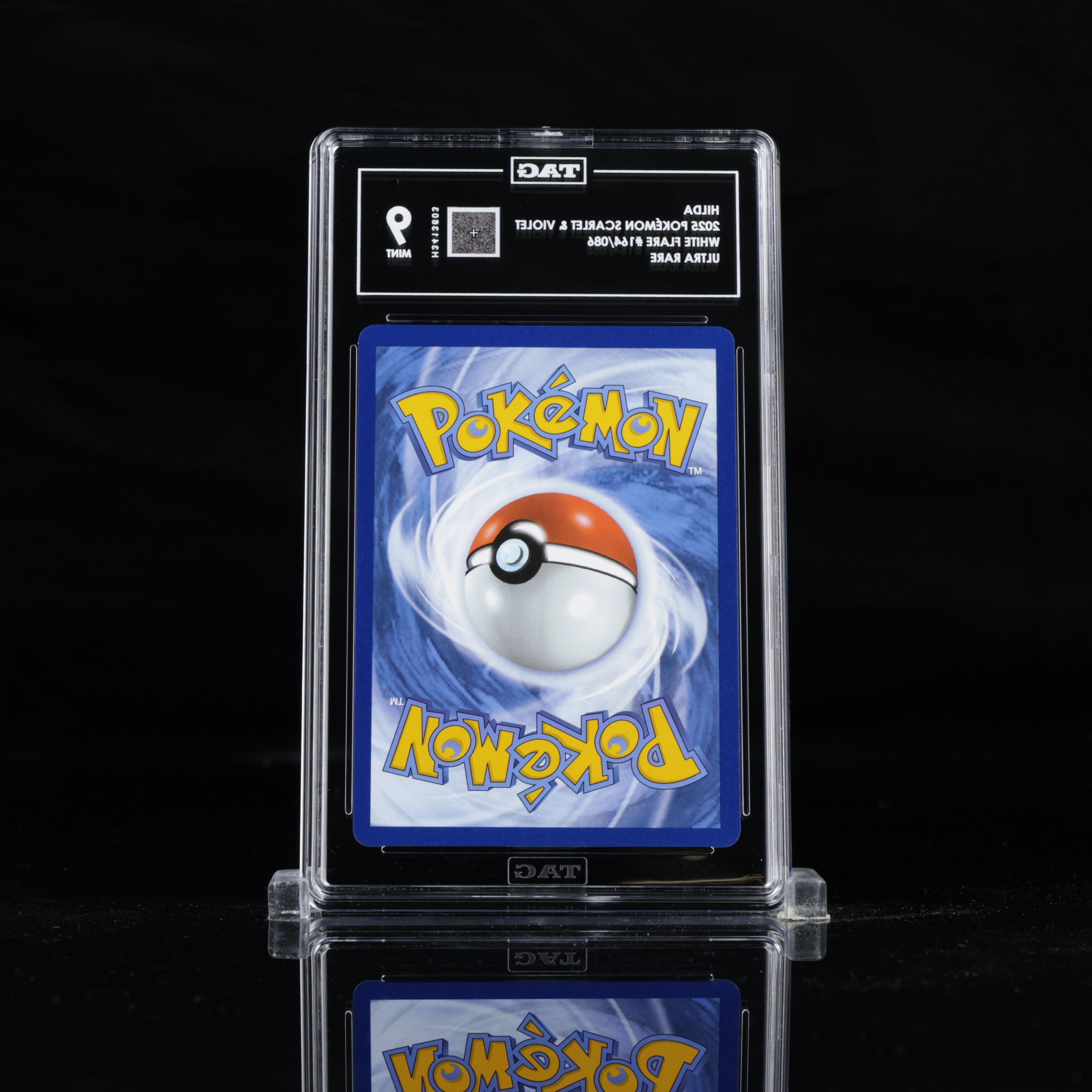 Back view of TAG slab for Hilda 164/086 English Ultra Rare — showing official Pokémon card back and TAG grading label with grade 9 (Mint) for authentication.
